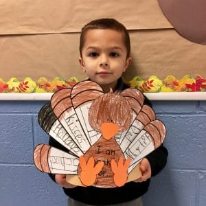 BVP scholar holding a Thanksgiving-themed art project