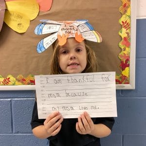 BVP scholar holding a sign about what she's thankful for